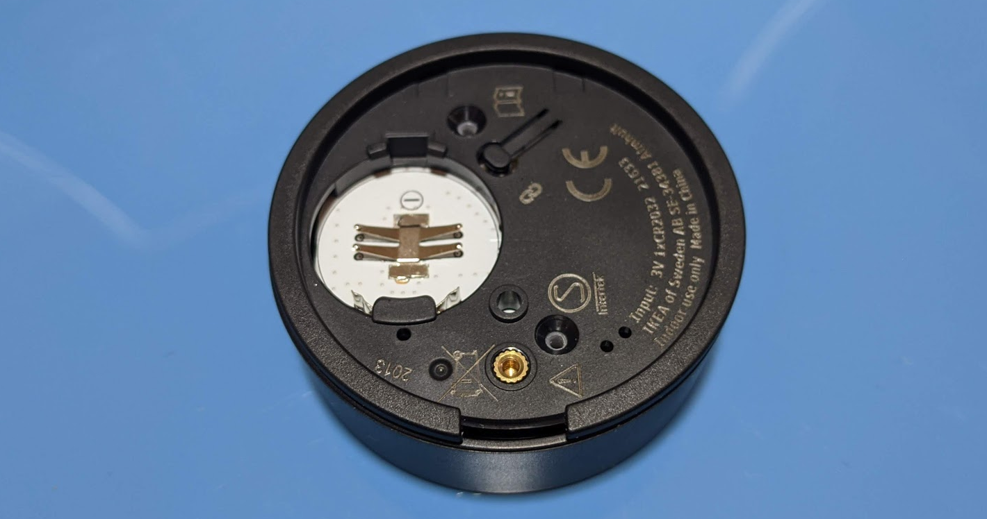 Torx screws removed to reveal countersunk holes